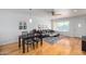 Open living room with hardwood floors, sectional sofa, and dining table at 4701 N 68Th St # 144, Scottsdale, AZ 85251