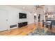 Living room with hardwood floors, ceiling fan, and a view of the kitchen at 4701 N 68Th St # 144, Scottsdale, AZ 85251