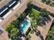 Aerial view showcasing a community pool surrounded by lush landscaping and apartment buildings at 4701 N 68Th St # 144, Scottsdale, AZ 85251