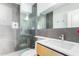 Modern bathroom with gray tile and a large mirror at 4701 N 68Th St # 144, Scottsdale, AZ 85251