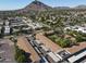 Aerial view of an apartment complex with a pool and landscaped grounds, near Camelback Mountain at 4701 N 68Th St # 144, Scottsdale, AZ 85251