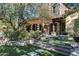 Stone patio with pergola, built-in grill, and lush landscaping at 20242 N 103Rd Way # 1246, Scottsdale, AZ 85255