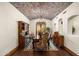 Elegant dining room with hardwood floors, a rustic chandelier, and built-in hutch at 20242 N 103Rd Way # 1246, Scottsdale, AZ 85255