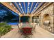 Outdoor patio with dining area, pergola, and built-in grill at 20242 N 103Rd Way # 1246, Scottsdale, AZ 85255