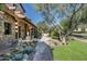 Charming stone patio with walkway and cacti, creating a welcoming entrance at 20242 N 103Rd Way # 1246, Scottsdale, AZ 85255