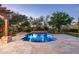 Inviting pool and spa area with a stone patio and mountain views at 20242 N 103Rd Way # 1246, Scottsdale, AZ 85255