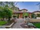 Elegant home exterior with stone pillars and walkway at 20242 N 103Rd Way # 1246, Scottsdale, AZ 85255