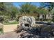 Outdoor stone fireplace and seating area, perfect for relaxing evenings at 20242 N 103Rd Way # 1246, Scottsdale, AZ 85255