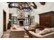 Relaxing living room with stone fireplace, comfortable seating, and high ceilings at 20242 N 103Rd Way # 1246, Scottsdale, AZ 85255