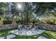 Stone firepit area with seating and lush landscaping at 20242 N 103Rd Way # 1246, Scottsdale, AZ 85255