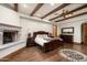 Large bedroom with hardwood floors, fireplace and a dresser at 20242 N 103Rd Way # 1246, Scottsdale, AZ 85255