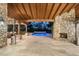 Relaxing pool and patio area with a stone fireplace and outdoor seating at 20242 N 103Rd Way # 1246, Scottsdale, AZ 85255