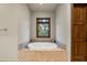 Relaxing bathroom with a large soaking tub and a window view at 20242 N 103Rd Way # 1246, Scottsdale, AZ 85255