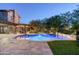 Inviting pool and spa area with flagstone patio and outdoor lighting at 20242 N 103Rd Way # 1246, Scottsdale, AZ 85255