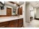Elegant bathroom with double vanity, large mirror, and a walk-in shower at 20242 N 103Rd Way # 1246, Scottsdale, AZ 85255