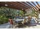 Outdoor dining area under a pergola with string lights at 20242 N 103Rd Way # 1246, Scottsdale, AZ 85255