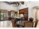 Open kitchen with granite island, custom cabinetry, and breakfast nook at 20242 N 103Rd Way # 1246, Scottsdale, AZ 85255