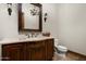 Elegant bathroom with a vanity, toilet, and decorative mirror at 20242 N 103Rd Way # 1246, Scottsdale, AZ 85255