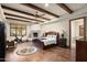 Main bedroom with hardwood floors, fireplace, and access to the en-suite bathroom at 20242 N 103Rd Way # 1246, Scottsdale, AZ 85255