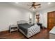 Comfortable bedroom with an upholstered bed frame, and a small workspace at 20242 N 103Rd Way # 1246, Scottsdale, AZ 85255