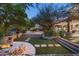 Wonderful backyard with a fire pit, pool, and terraced landscaping at 20242 N 103Rd Way # 1246, Scottsdale, AZ 85255