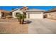 Charming single story home with a two car garage and desert landscaping at 980 S 220Th Ln, Buckeye, AZ 85326