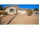 Landscaped front yard with gravel and desert plants at 980 S 220Th Ln, Buckeye, AZ 85326