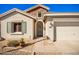 Well-maintained home with a two-car garage and attractive landscaping at 980 S 220Th Ln, Buckeye, AZ 85326