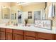 Chic bathroom with wood vanity, decorative accents and mirror at 980 S 220Th Ln, Buckeye, AZ 85326
