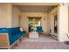 Relaxing covered patio with comfortable seating at 980 S 220Th Ln, Buckeye, AZ 85326