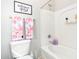 Clean bathroom with floral towels and bathtub at 980 S 220Th Ln, Buckeye, AZ 85326
