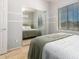 Bright bedroom with window and mirrored closet at 980 S 220Th Ln, Buckeye, AZ 85326