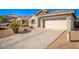 Spacious driveway leading to a two-car garage at 980 S 220Th Ln, Buckeye, AZ 85326