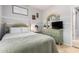 Cozy bedroom with a green dresser and window seat at 980 S 220Th Ln, Buckeye, AZ 85326