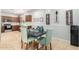 Kitchen with wooden cabinets, stainless steel appliances, and an adjacent dining area at 980 S 220Th Ln, Buckeye, AZ 85326