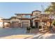 Two-story house with a three-car garage and landscaped front yard at 18657 E Pine Barrens Ave, Queen Creek, AZ 85142