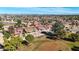 Aerial view of a community with houses near a golf course at 14223 W White Rock Dr, Sun City West, AZ 85375