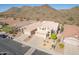 Aerial view of a house on a residential street with desert landscaping at 1926 E Siesta Ln, Phoenix, AZ 85024