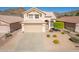 Two-story home with attached garage and well-manicured landscaping at 1926 E Siesta Ln, Phoenix, AZ 85024