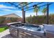 Hot tub with pergola under a clear sky at 45075 W Gavilan Dr, Maricopa, AZ 85139