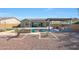 Landscaped backyard featuring a pool, outdoor kitchen and pergola at 16918 S 180Th Dr, Goodyear, AZ 85338