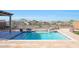 Enjoy this beautiful pool with water features and spacious patio at 16918 S 180Th Dr, Goodyear, AZ 85338