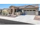 Single-story home with stone accents and a two-car garage at 16918 S 180Th Dr, Goodyear, AZ 85338