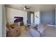 Spacious living room with hardwood floors and comfortable seating at 16918 S 180Th Dr, Goodyear, AZ 85338