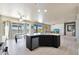 Open concept kitchen with island and stainless steel appliances at 16918 S 180Th Dr, Goodyear, AZ 85338
