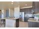 Modern kitchen with stainless steel appliances and an island at 16918 S 180Th Dr, Goodyear, AZ 85338