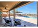 Relaxing backyard oasis with a sparkling pool, fire pit, and covered patio at 16918 S 180Th Dr, Goodyear, AZ 85338