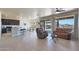 Open living area with large windows and access to backyard at 16918 S 180Th Dr, Goodyear, AZ 85338