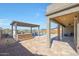 Outdoor kitchen and pergola adjacent to the pool at 16918 S 180Th Dr, Goodyear, AZ 85338
