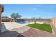 Private backyard with a sparkling pool, patio, and artificial turf at 16918 S 180Th Dr, Goodyear, AZ 85338